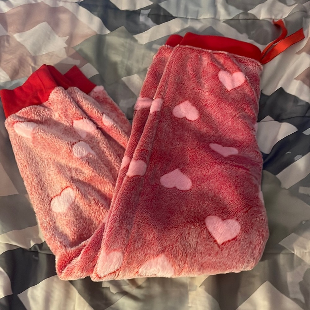 I’m selling red pj pants with hearts on them